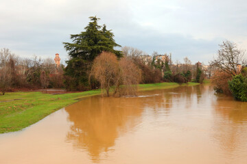 Fototapeta na wymiar flooded fields and the bend of the Retrone River in the city of VICENZA in Northern Italy after the flooding