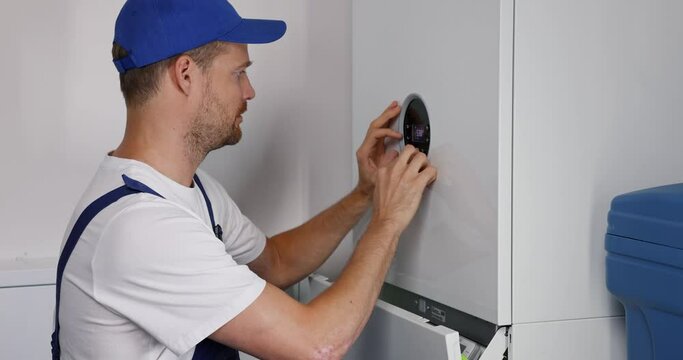 maintenance and repair service engineer working on house gas heating boiler