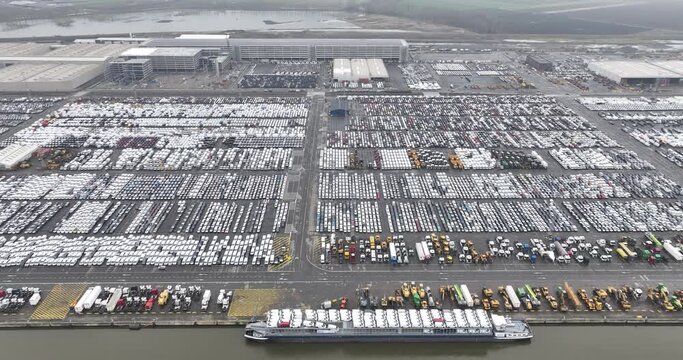 Antwerp Euroterminal is the largest multipurpose terminal in the port of Antwerp. Transportation of cars, mobility industry. Global logistics over sea. Cars, trucks, and other goods.