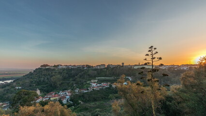 Panorama showing sunset over the Castle of Almourol on hill in Santarem aerial timelapse. Portugal