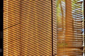 shadows from the blinds on the window slope