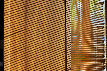 shadows from the blinds on the window slope