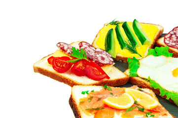 appetizing sandwiches in a gray plate on a white background. slices of bread with vegetables and meat in a plate on a light texture