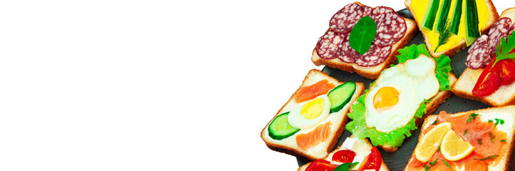 appetizing sandwiches in a gray plate on a white background. slices of bread with vegetables and meat in a plate on a light texture