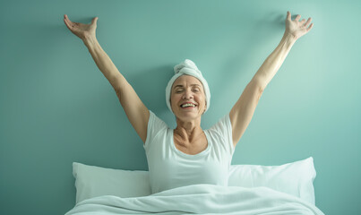 Senior woman on hospital bed celebrating her recovery from surgery or beating cancer - obrazy, fototapety, plakaty
