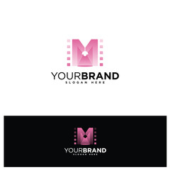 Elegant letter M with strip film and spot light for film production