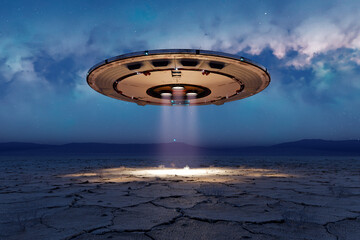Alien invasion Circular shiny metal flying saucer over the empty desert at night © Dabarti