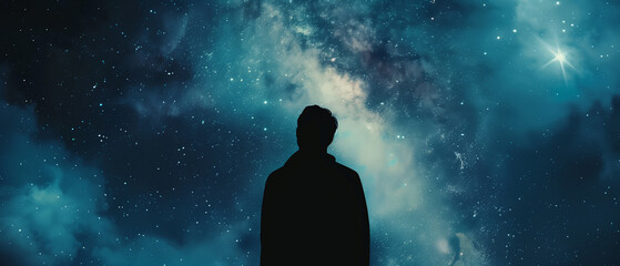 Fototapeta na wymiar a silhouette of a man standing against the backdrop of a massive, dark blue galaxy in space
