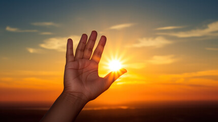 hands holding the sun at dawn.
