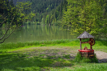 Lacu Rosu lake in Transylvania, Romania, Europe. Lacu Rosu is a popular travel destination in Romania, close to Cheile Bicazului and Ceahlau Mountains. Red lake is a natural barrier dam lake
