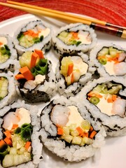 Fresh Sushi Variety on White Plate with Chopsticks - Home Cooked Japanese Cuisine