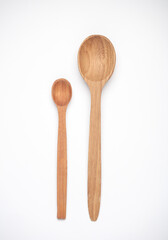 Set of different wooden spoons on white background
