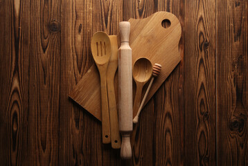 Set of wooden eco kitchen utensils on boards. Flat lay. Top view