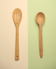 Wooden spoons on a colored background