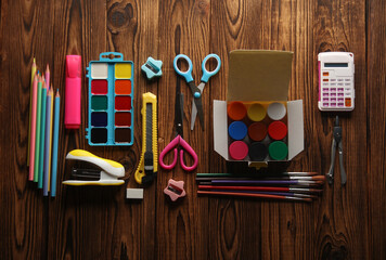 Set of school stationery for children's creativity on wooden boards. Flat lay
