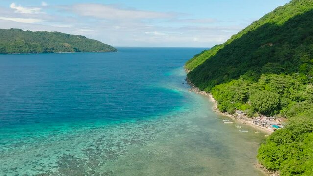 Tropical landscape with blue sea and turquoise water at coast. Romblon Island. Philippines.