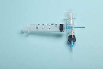 Syringes on a blue background. Medicine concept