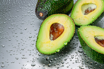 fresh raw avocado in water drops, healthy vegetarian food created with generative ai technology