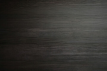 close up of the surface of a black dark flooring wood wall wooden plank board texture background with structures and grains