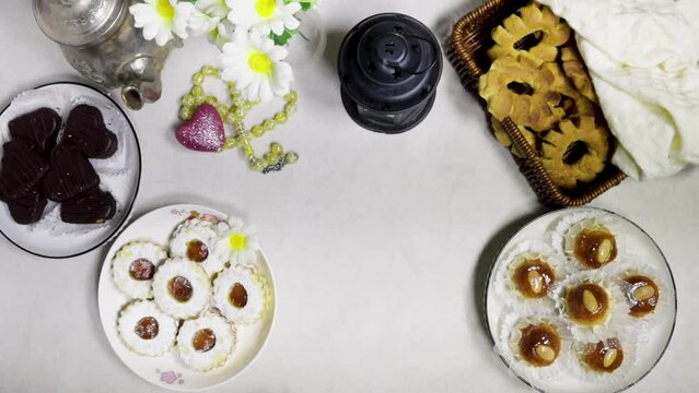 eid holiday table : Oriental Algerian sweet cookies named dziriettes and kaak tlemcen is dry cookies, heart shaped chocolate with jam apricot cookies