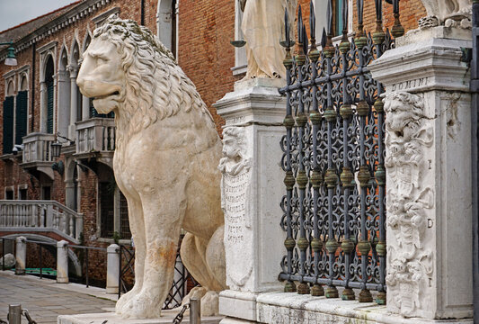 Venice, Italy–Sept. 18, 2023: The ancient lion of Piraeus, brought to the city from Greece in the 17th century, stands guard at the historic Arsenal, once an armory and shipbuilding center.