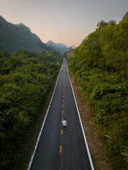 Man on the road in Cat Ba mountains in Vietnam