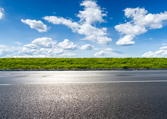 abstract empty road in summer, blue sky, white clouds, highway or speedway in rural countryside created with generative ai technology