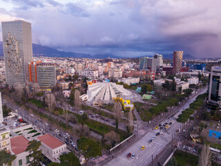 Wander full sky and sunset after rain in Tirana Albania, main boulevard rainbow over city, 7 March 2024
