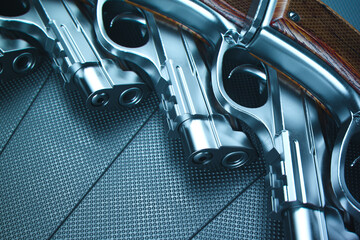 Detailed Double Revolvers Display on a Rugged Metallic Surface