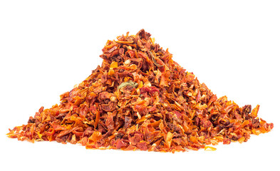 Pile of dried and chopped tomatoes flakes isolated on a white background