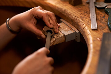 Carpentry, industry and hands of woman in workshop for creative project or sculpture. Artisan, industrial and closeup of female person manufacturing products in studio for woodworking small business. - Powered by Adobe