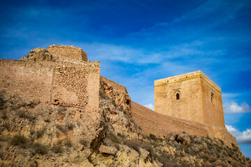 View of the imposing Alfonsina tower of the medieval castle of Lorca, Region of Murcia, Eepaña, in daylight