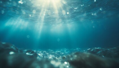 Underwater background with blue water and sun rays