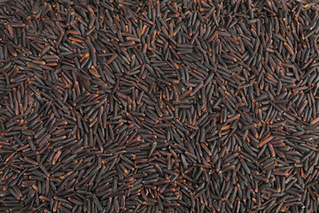 Black rice as a background. Top view. Flat lay