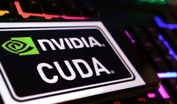 Viersen, Germany - March 1. 2024: Closeup of smartphone screen with logo lettering of Nvidia Cuda on computer keyboard
