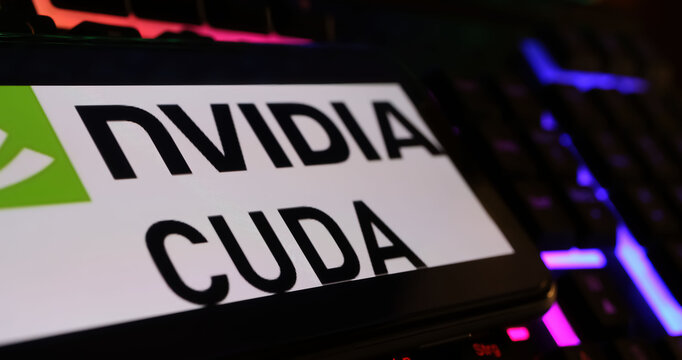 Viersen, Germany - March 1. 2024: Closeup of smartphone screen with logo lettering of Nvidia Cuda on computer keyboard