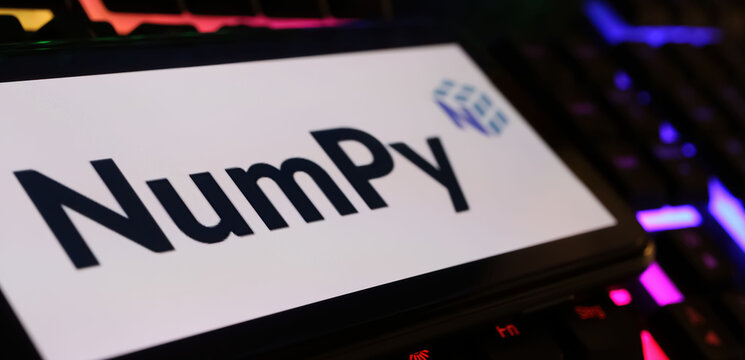 Viersen, Germany - March 1. 2024: Closeup of smartphone screen with logo lettering of NumPy on computer keyboard