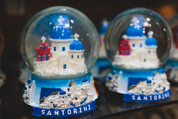 Traditional tourist souvenirs and gifts from Santorini island, Thira, South Aegean, Greece, fridge...
