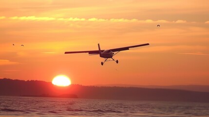 Fototapeta na wymiar a plane flying over a body of water with a sunset in the background with a plane flying over a body of water.