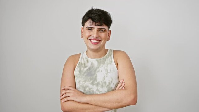 Cheerful young man, wearing sleeveless t shirt, strikes confident pose with crossed arms. isolated on white backround, he's all smiles, optimism oozing from him.