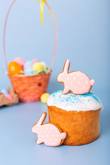Two pink gingerbread in the form of a rabbit on Easter cake