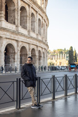 person standing in front of coliseum of Rome 