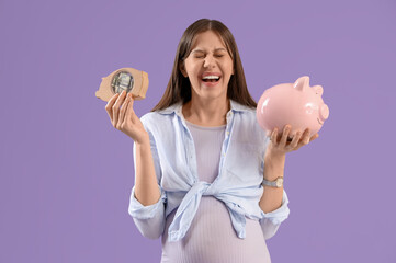 Happy young pregnant woman with piggy banks on lilac background. Maternal Benefit concept