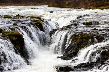 A waterfall in Iceland in Scandinavia in northern Europe, in the land of fire and ice,