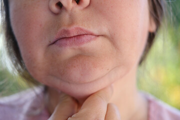 close up part face mature woman 55 years old, lower half of face, deep wrinkles around mouth,...
