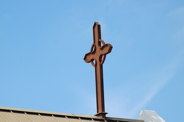 A Celtic Cross sits atop an Anglican Church in the Park Cities of Dallas. 