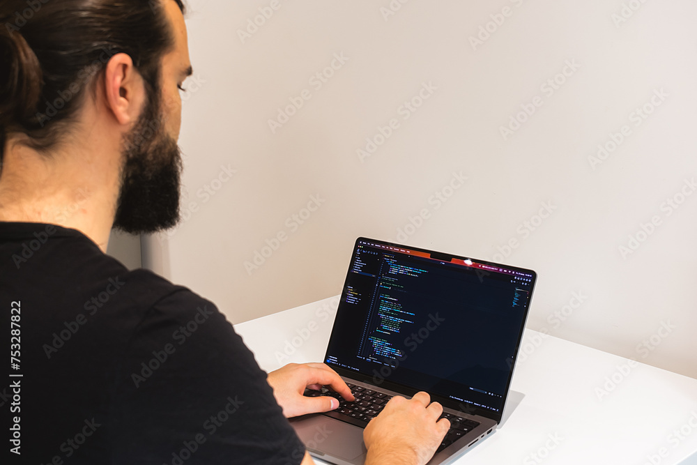 Wall mural professional software engineer, it specialist, programmer, working at home and writing code on a lap