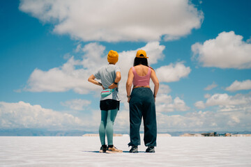 tourist on Pools in Salinas Grandes, Jujuy, Argentina - mar 2th 2024 - obrazy, fototapety, plakaty