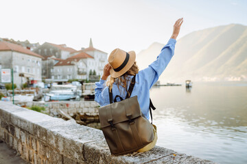 A woman tourist walks and enjoys the views and attractions. Travelling, lifestyle, adventure.