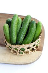 Mini cucumbers on white background.